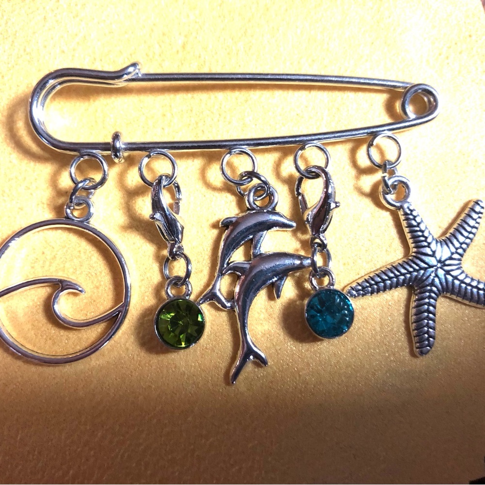 NWT, Handmade by A Charmed Life. Silver seashore charms on a silver pin